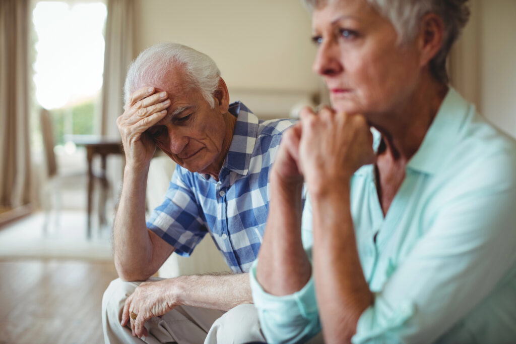Upset senior couple