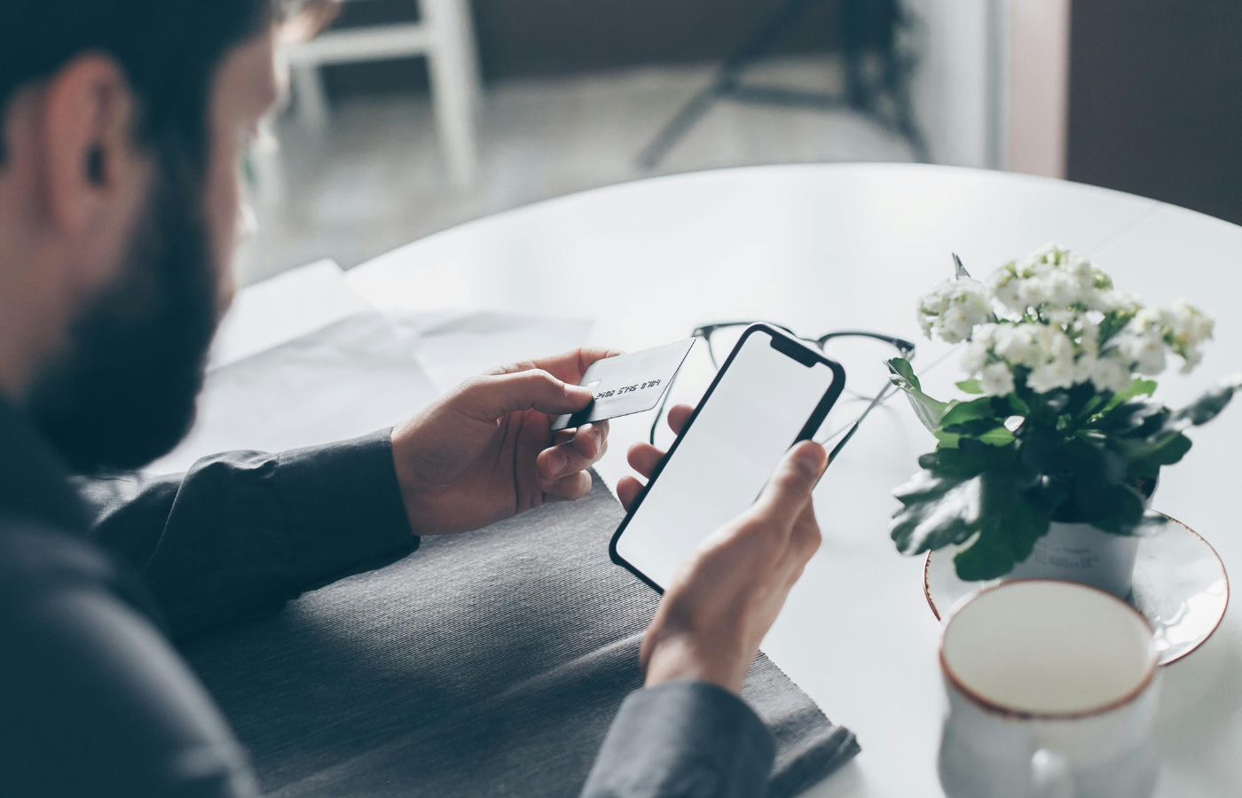A man worried while checking their credit score on a phone