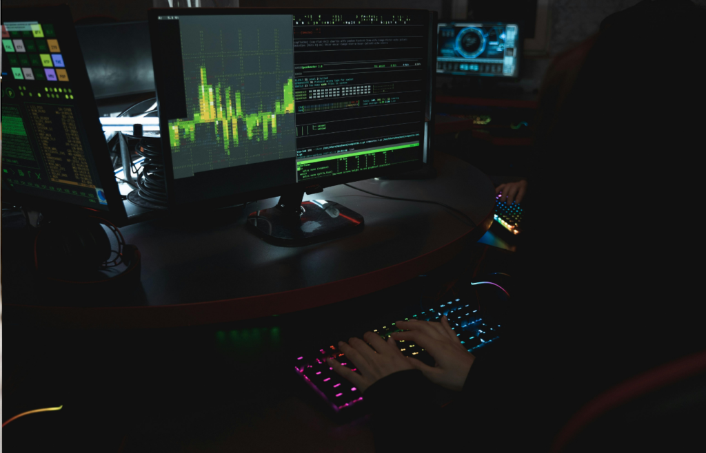 A cybersecurity expert monitoring network activity on screens