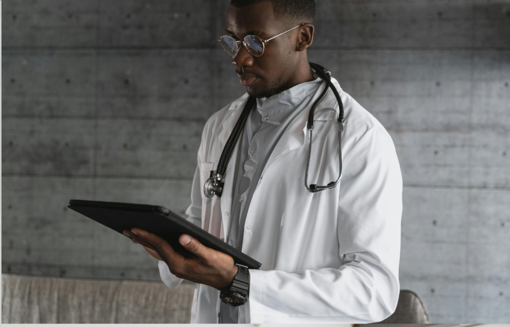 A healthcare professional using a tablet