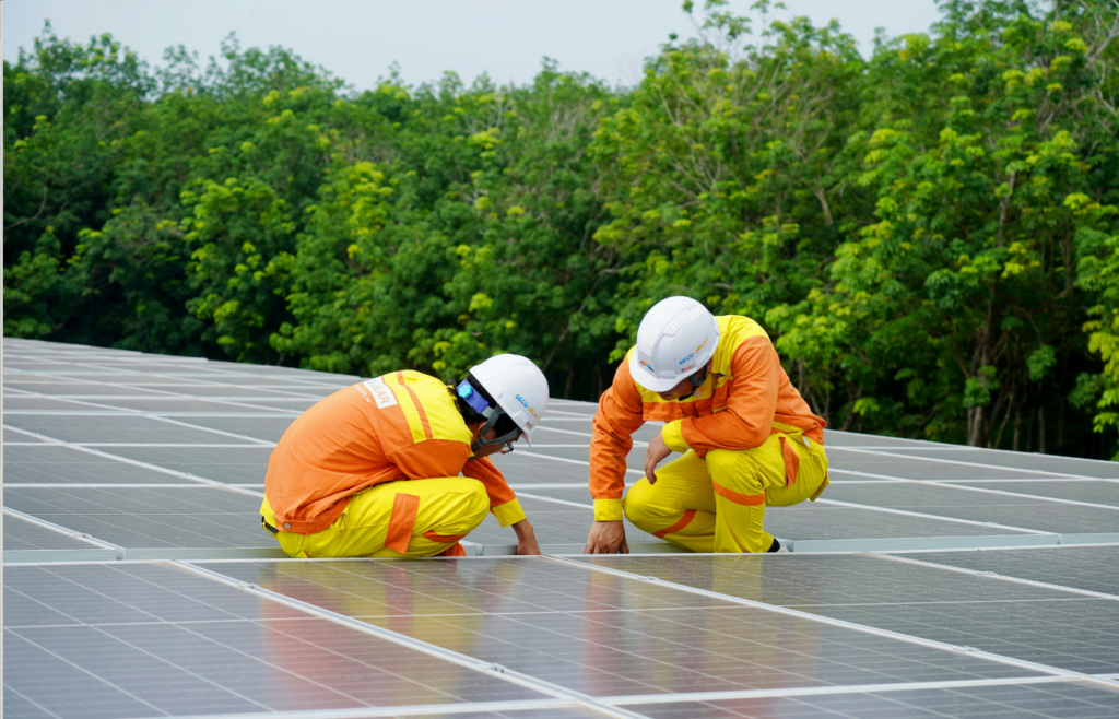 Engineers working on solar panels