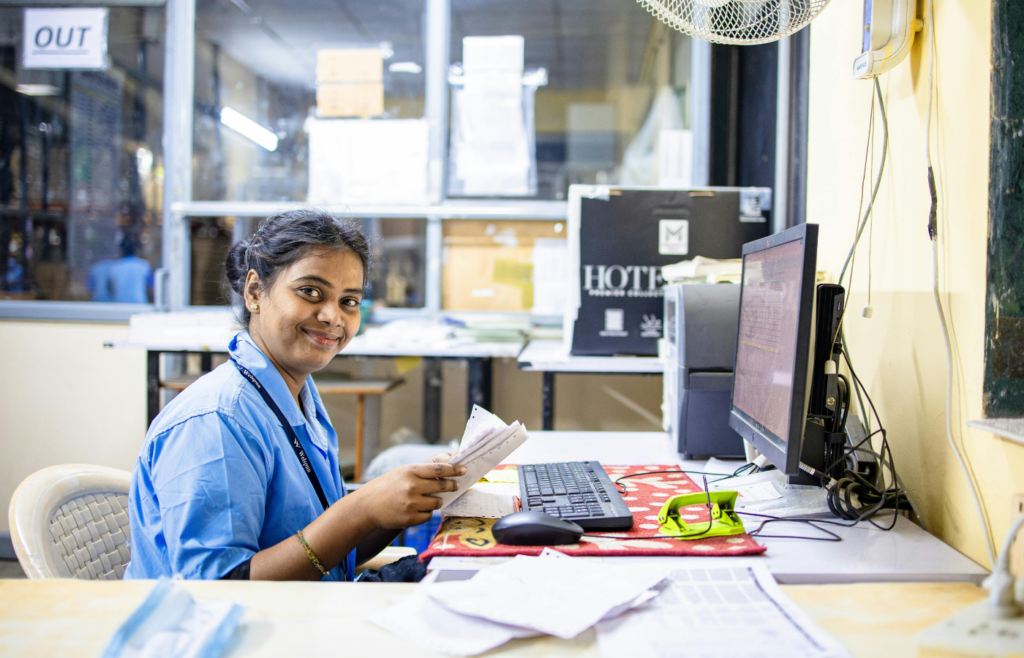A employee working in an office cubicle.