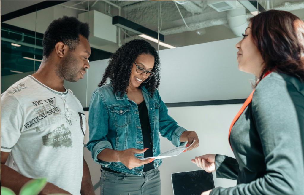 A person confidently holding real estate document