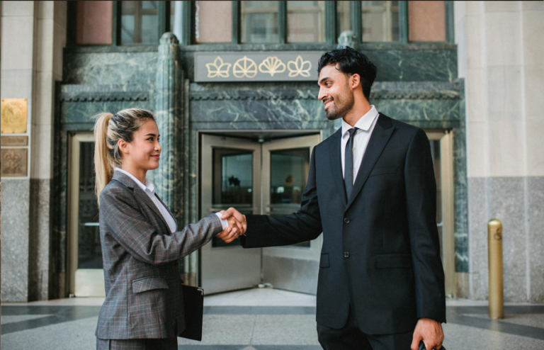 A professional shaking hands with their employer