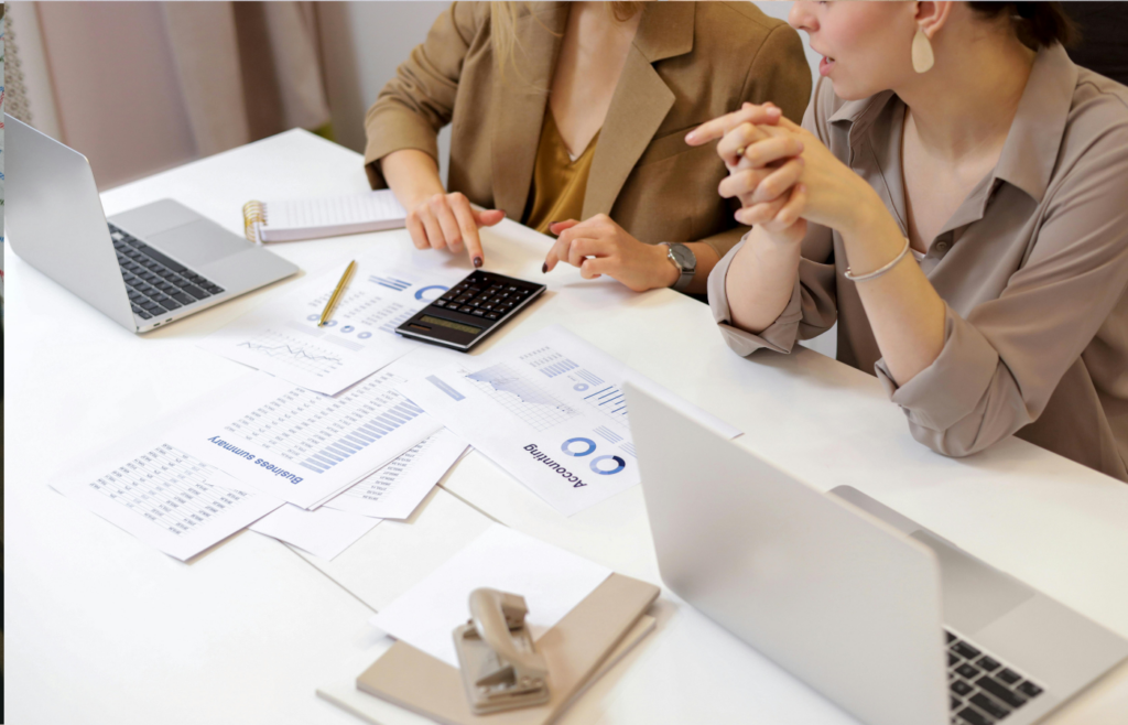 Two worker looking at their investment account