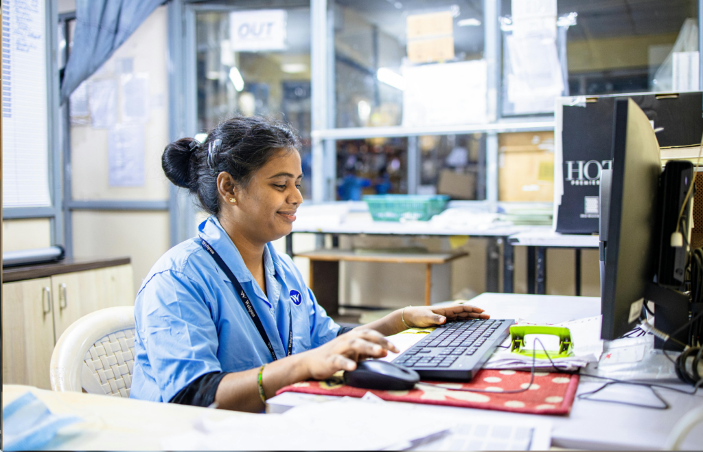 A employee staring blankly at a computer screen