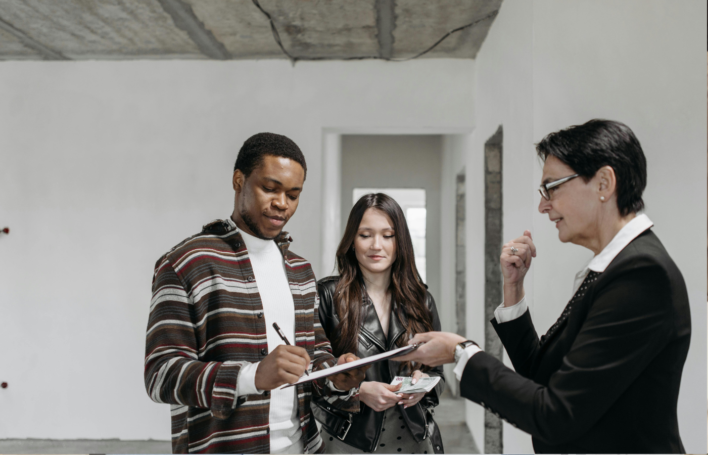 A financial rep handing over a confusing annuity contract to a retiree.