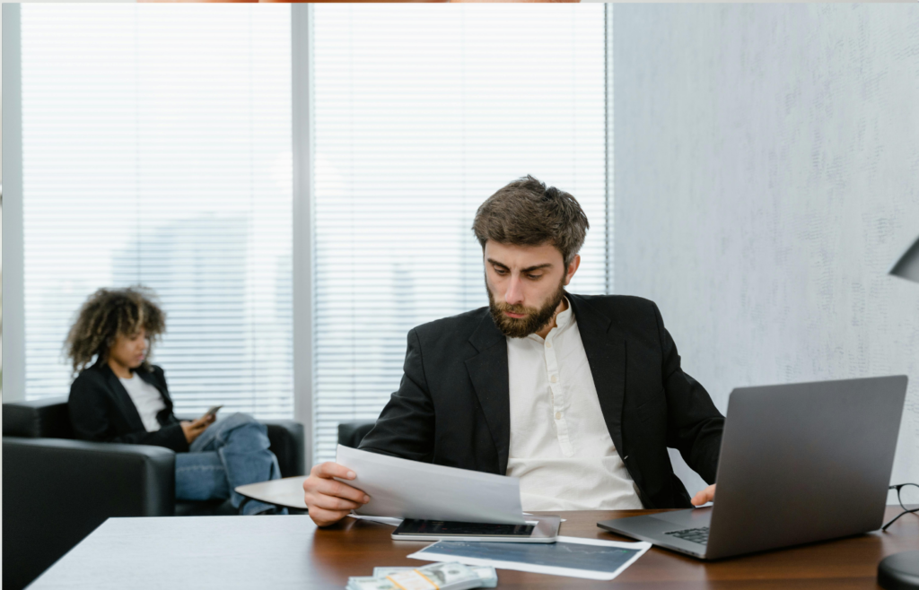 A disappointed person looking at an document