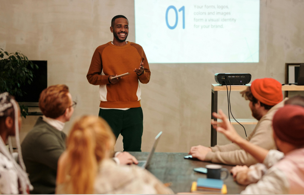 A professional confidently speaking in front of a group