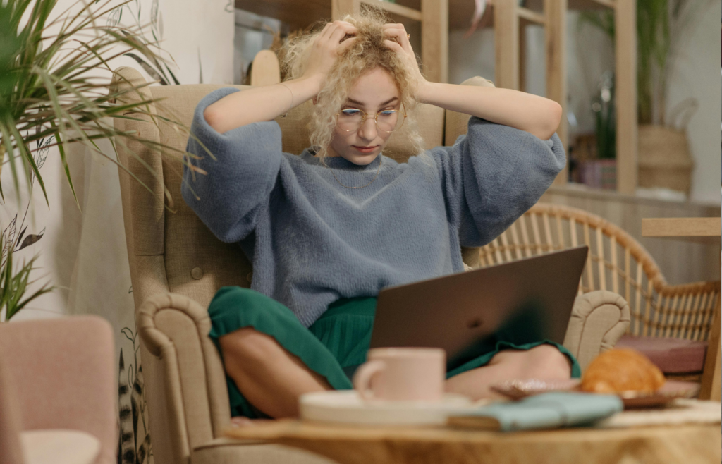 A business owner
sitting next to unsold inventory, looking frustrated.