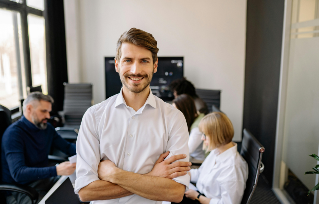 An employee crossing their arms and making demands in a meeting