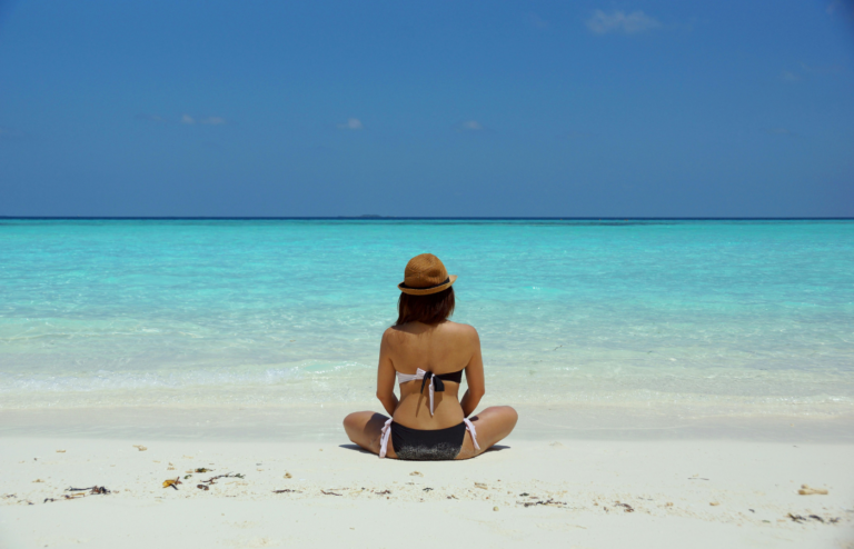 A woman relaxing on a beach