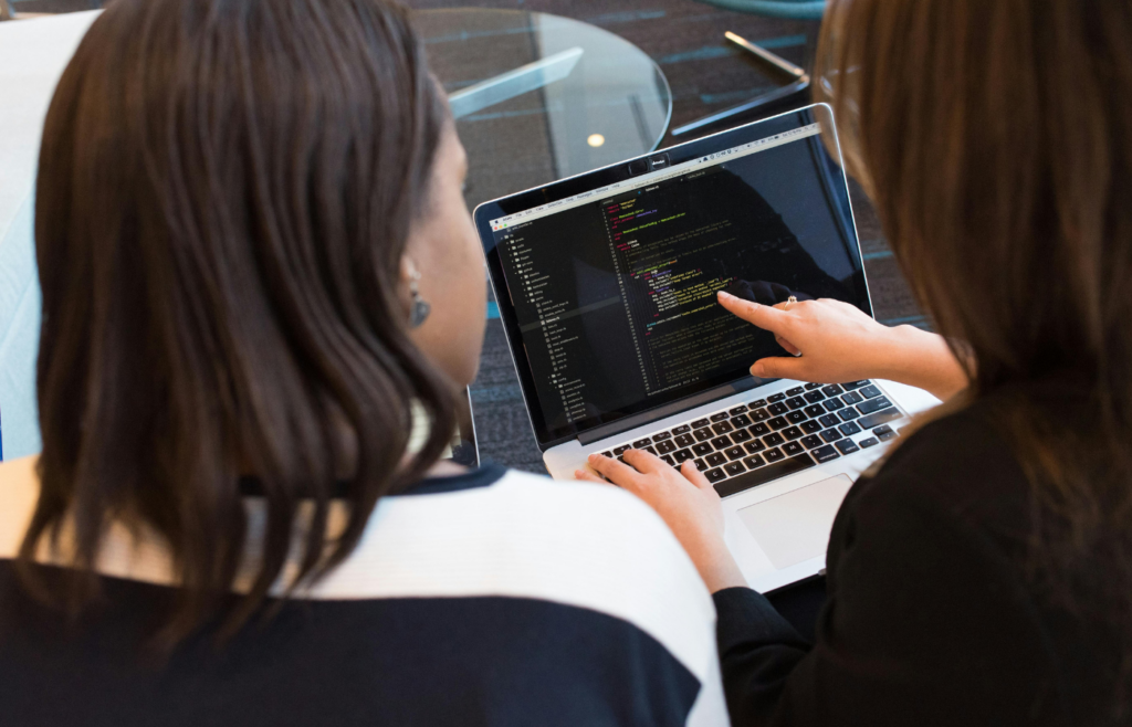 A programmer working on code in a modern office