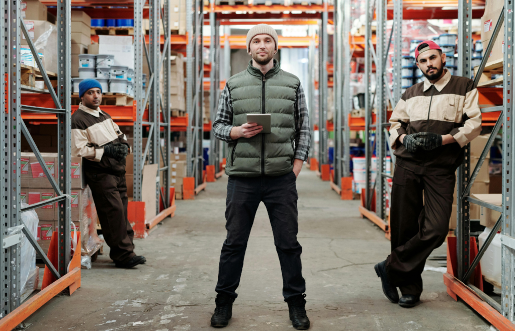 Warehouse Supply Chain Manager and worker Standing