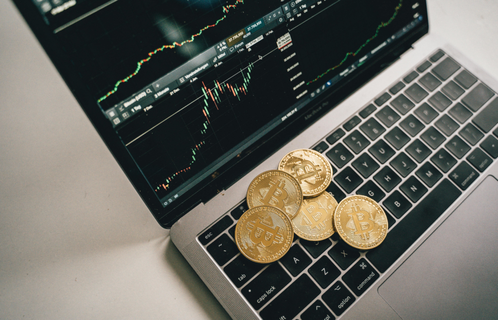 Bitcoins On Top of a Laptop