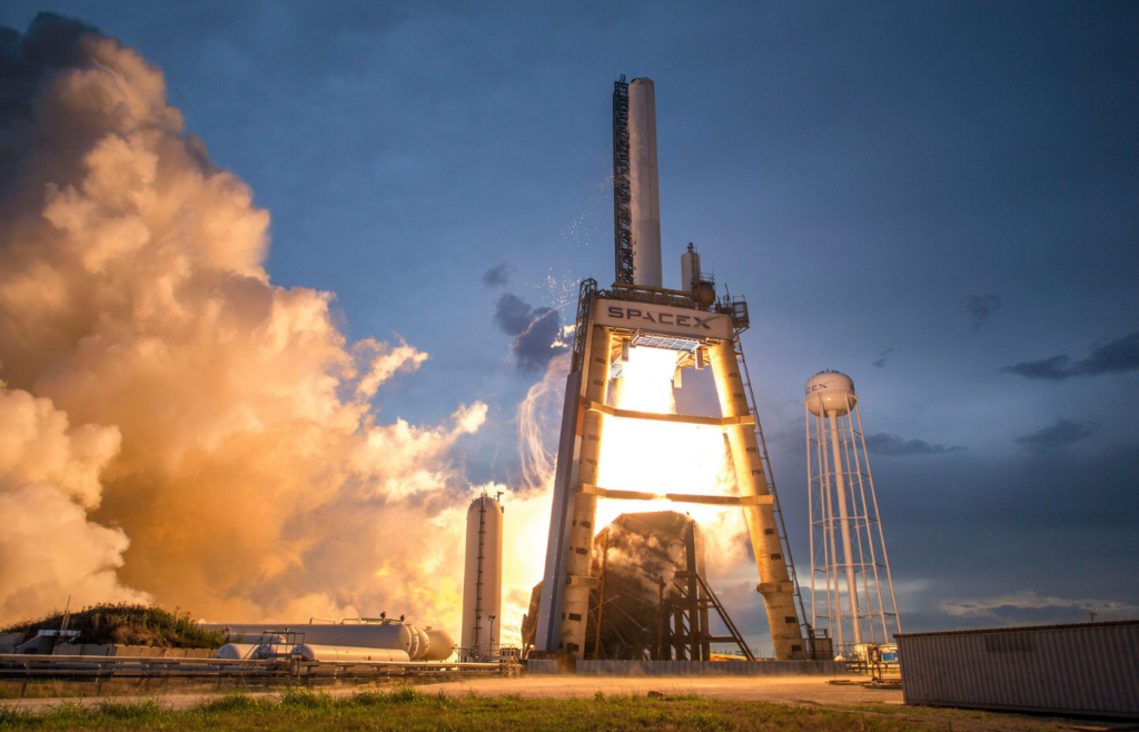 A SpaceX rocket launching into the sky.