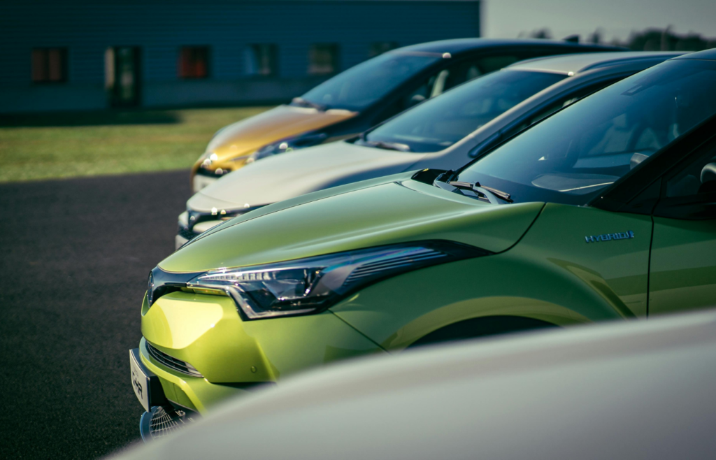 A lineup of electric vehicles from various brands.