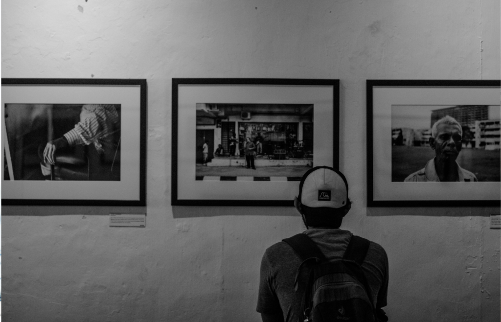 A person observing a painting in a Home