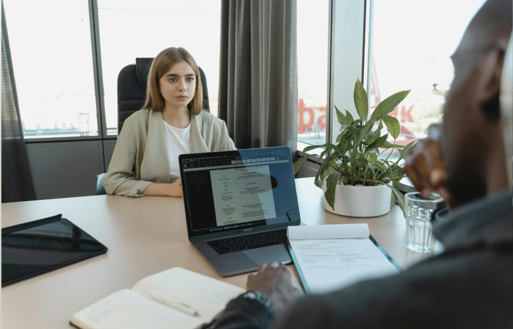 A confident candidate explaining something to an interviewer
