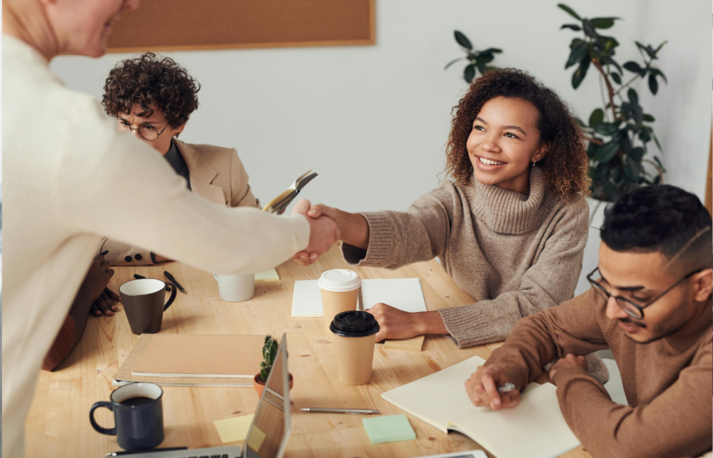 A candidate smiling while discussing company research