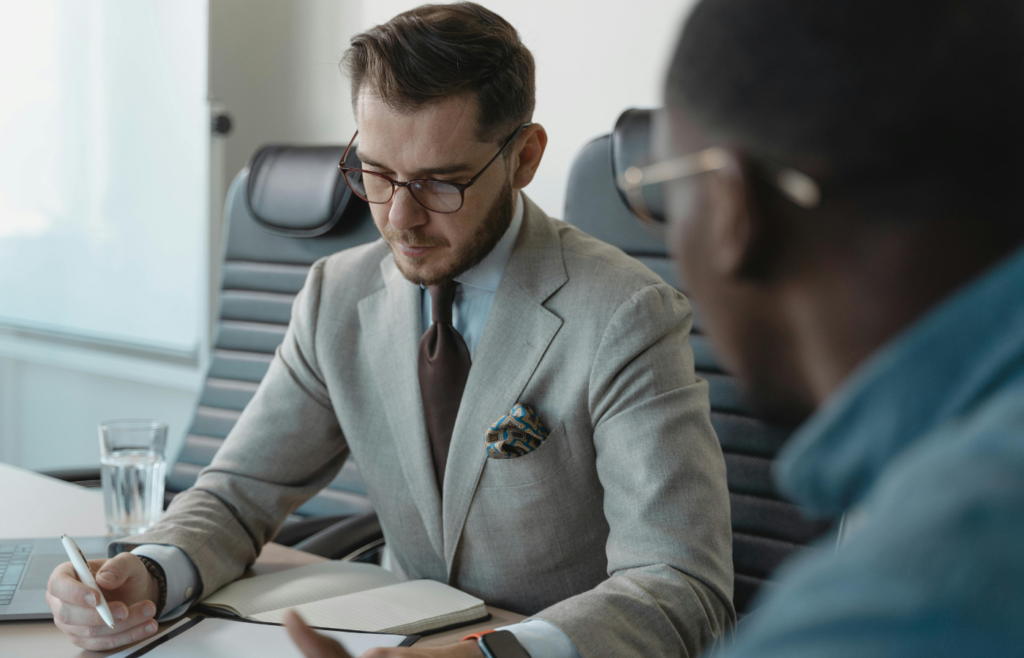 A professional receiving feedback from a manager