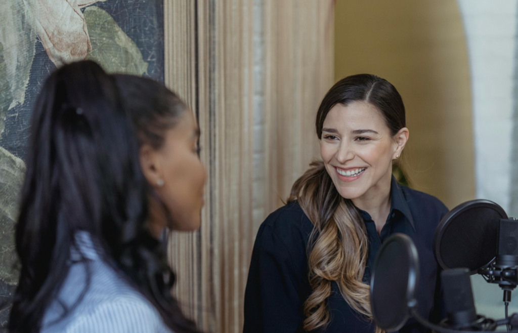 A candidate engaging in conversation with an interviewer