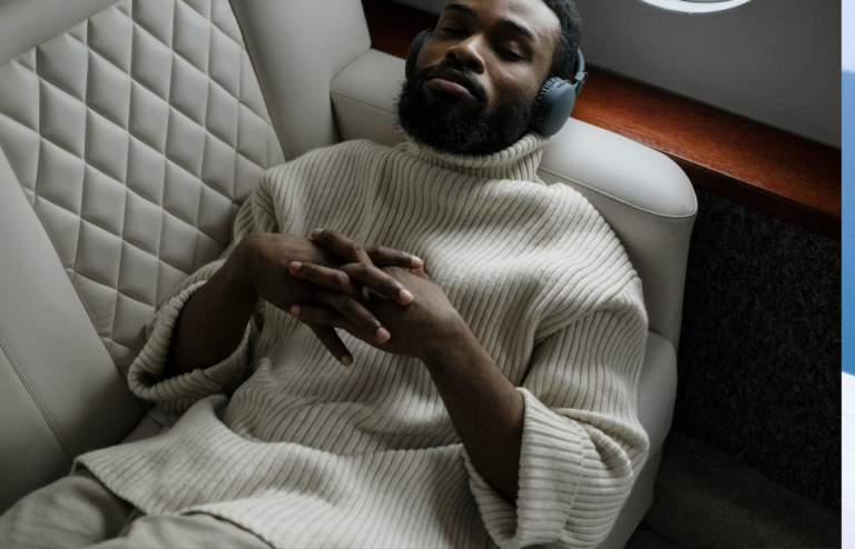 A relaxed traveler reclining in a spacious airplane seat