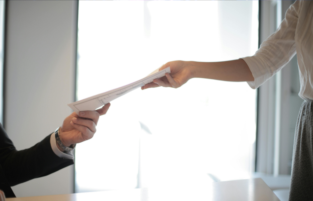 Job Applicant Passing Her Documents