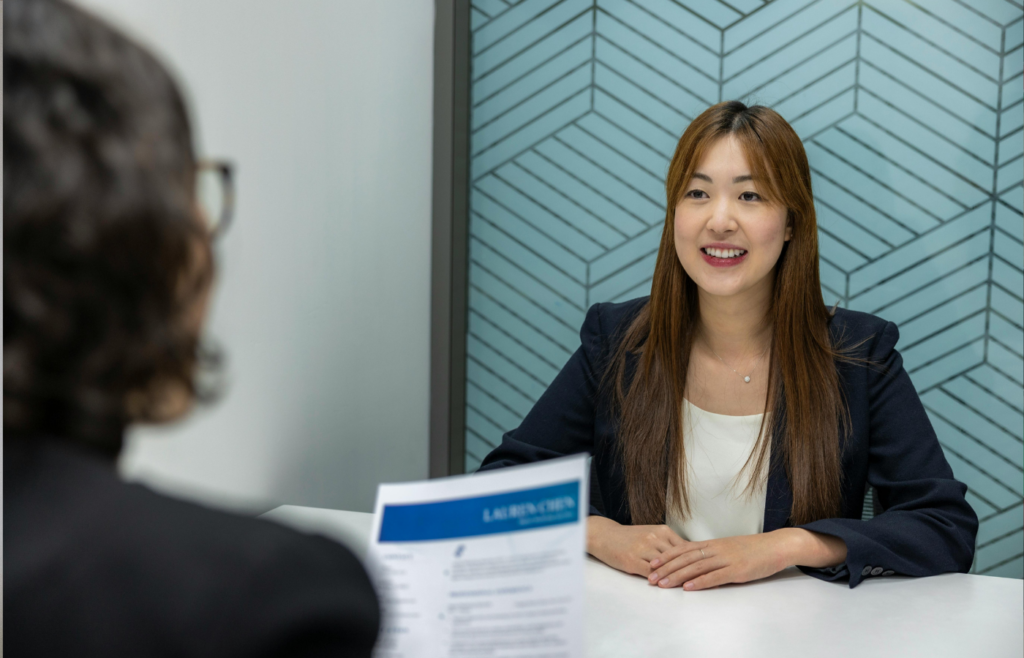 A recruiter holding a one-page resume
