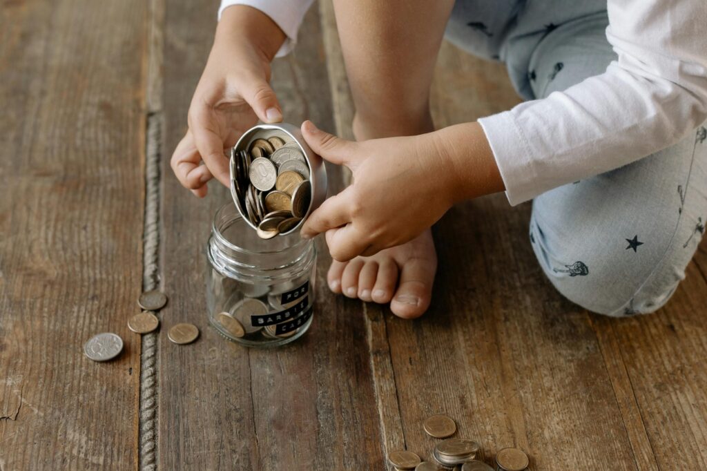 A jar labeled with coins inside