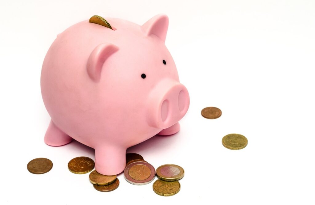 A piggy bank with a “Retirement” label next to baby items