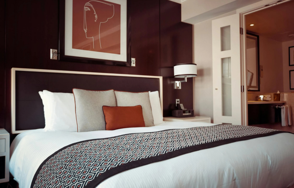 A luxurious bed with high-quality mattress and bedding in a serene bedroom