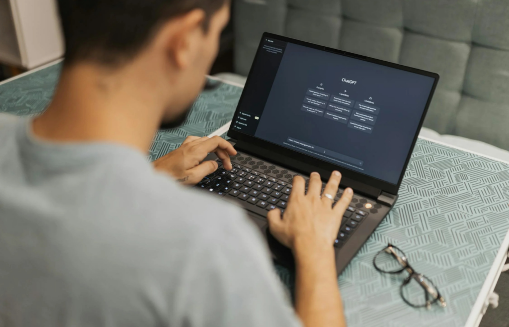 A person typing prompts into an AI chatgpt interface