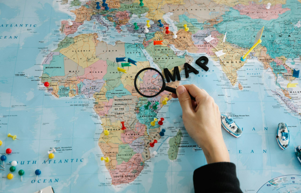 Person Holding Magnifying Glass