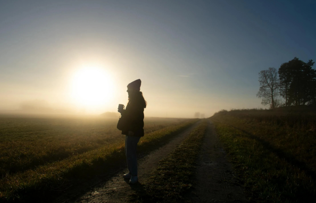 A man is standing on the road, contemplating the roads