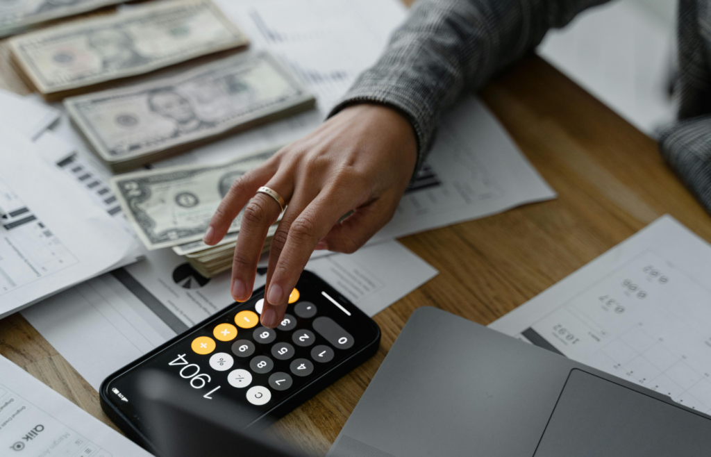 A person transferring money into a savings account via a smartphone