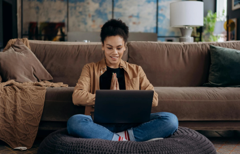 A women working on a laptop in a home office