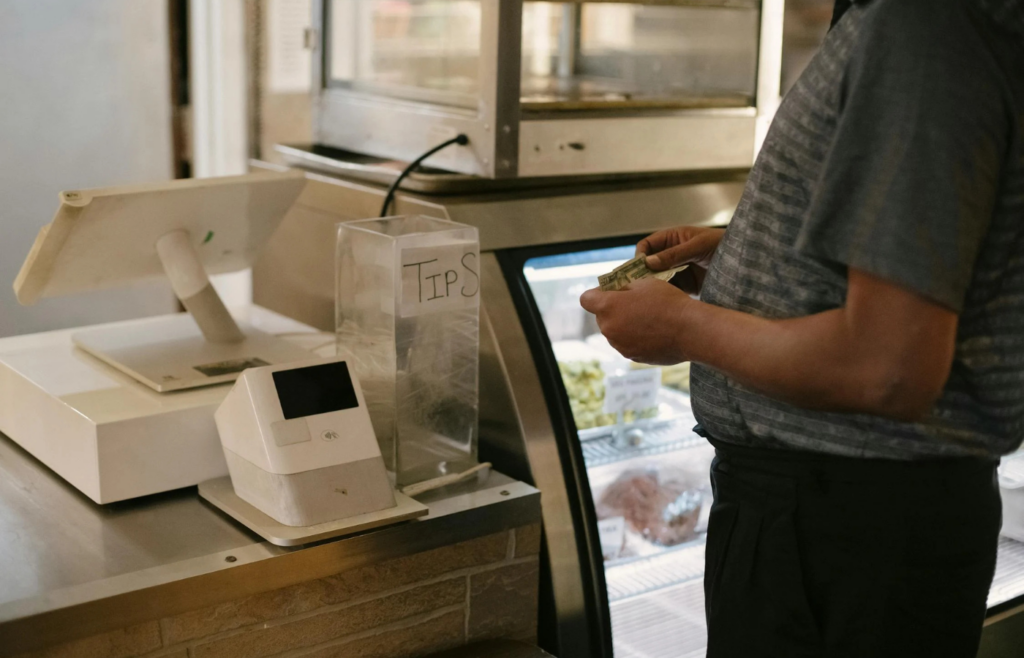 A shopper comparing prices in a grocery store