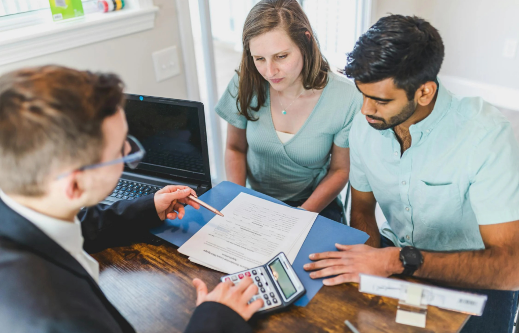 A couple consulting with a financial advisor