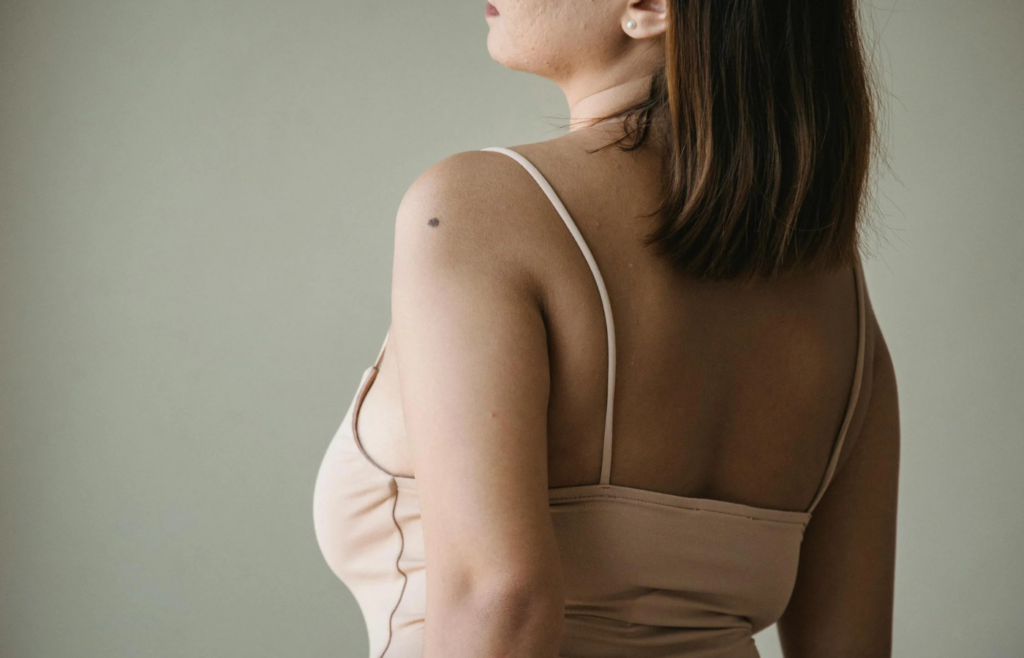 A person standing upright with shoulders back and head high