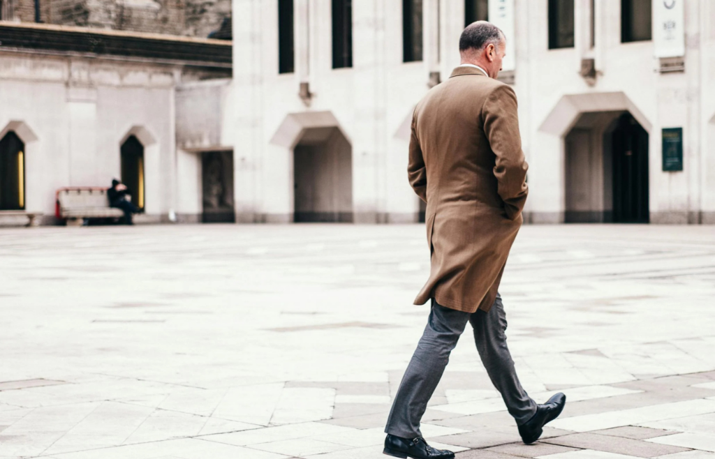 An individual walking with a confident stride