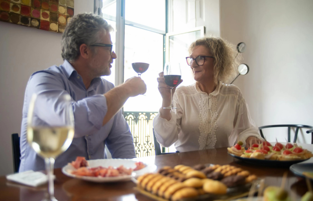 A retired couple enjoying a meal in an exotic locale