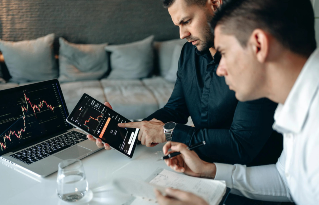 A retiree reviewing cryptocurrency charts on a tablet