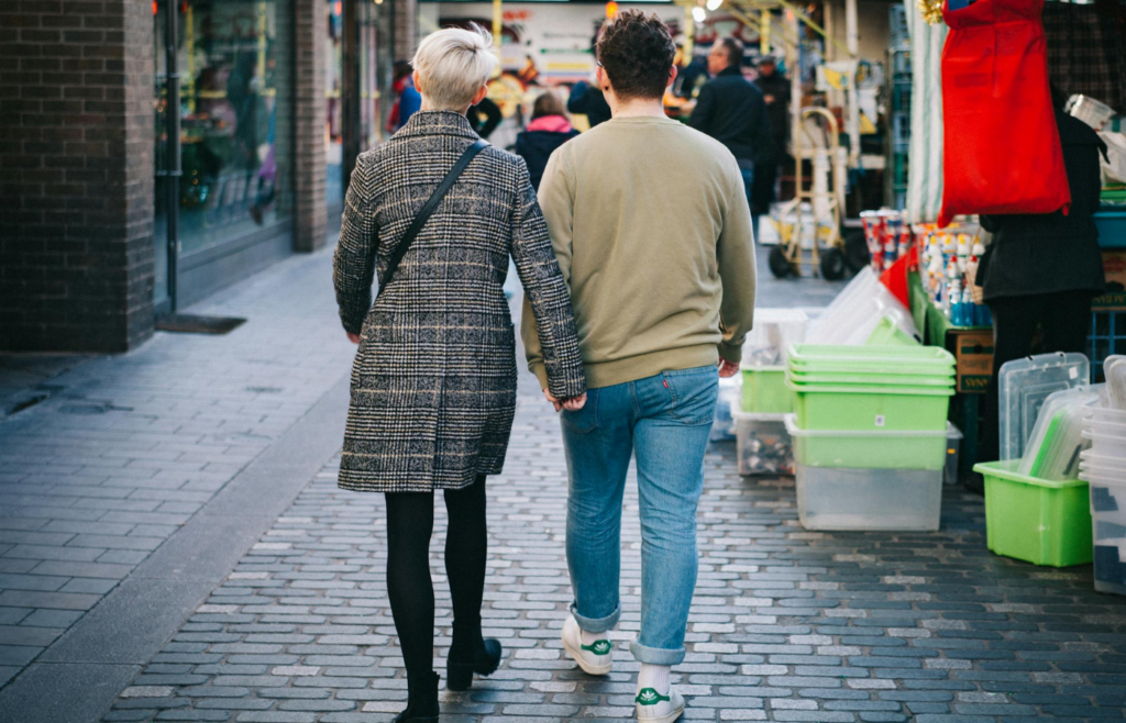 A retiree couple exploring a bustling cityscape