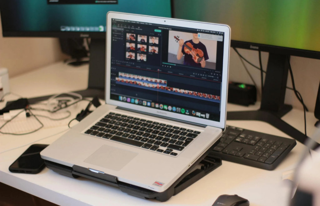 A creative professional editing short videos on a Laptop
