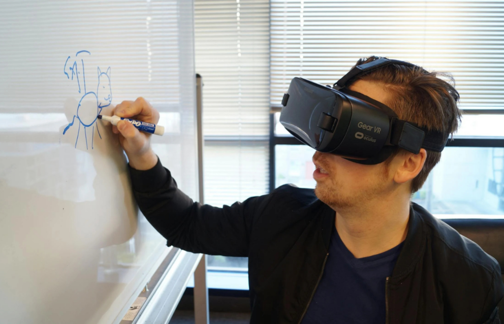 A designer mapping out a digital customer journey on a whiteboard