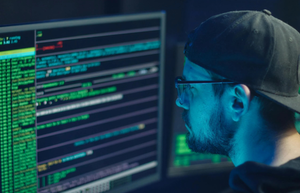 A cybersecurity analyst monitoring real-time threat alerts