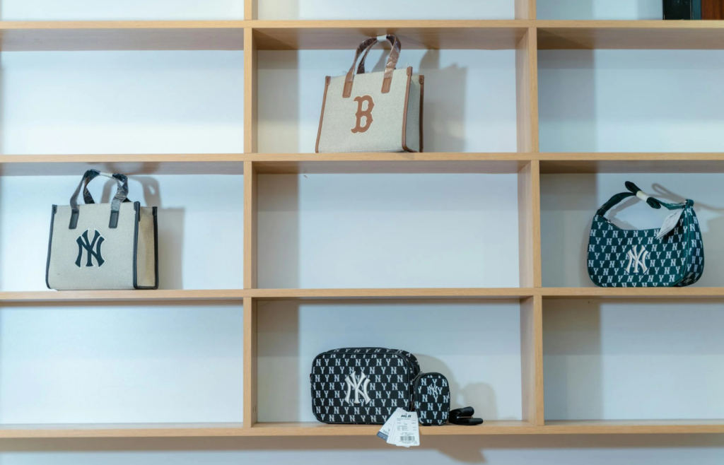 A classic designer handbag showcased elegantly on a boutique shelf