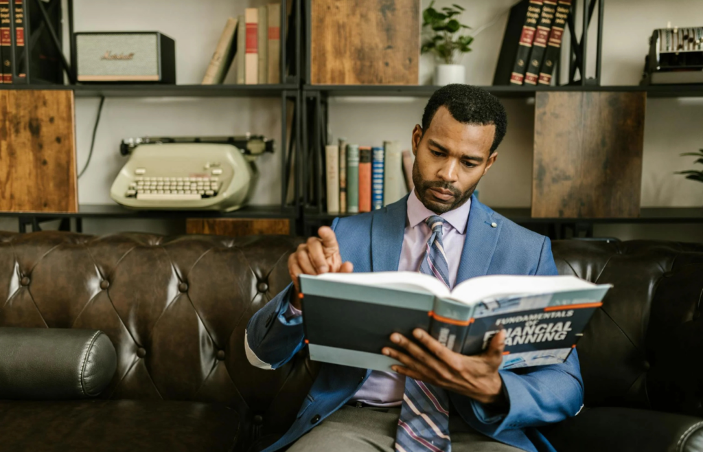 A person reading a financial book