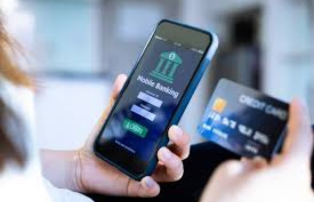 A person holding a smartphone displaying a banking app